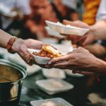 The help of volunteers helps to donate free food to the starving people.